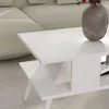 A close-up shot of a white coffee table with a vase on it, next to a sofa. Podgląd zdjęcia produktu