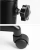 Close-up shots of a black adjustable salon trolley, showing a height adjustment knob and a caster wheel. Podgląd zdjęcia produktu