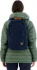 A person wearing a green jacket and a navy backpack. Náhled obrázku produktu
