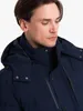 Close-up of a man wearing a navy winter jacket. Produktbild-Vorschau
