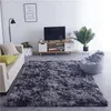 A living room scene with a sofa, rug, TV stand, and beanbag chair. Náhled obrázku produktu
