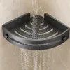 Dunkelgraues Eckduschregal aus Metall, mit Wasser, das aktiv darüber und davon abfließt, was seine Entwässerung demonstriert Podgląd zdjęcia produktu