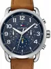 A close-up of a Tommy Hilfiger watch with a blue dial and a brown leather strap. Produktbild-Vorschau