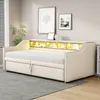 A beige upholstered daybed with storage drawers and LED lighting is shown in a bedroom setting. Produktbild-Vorschau