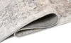 A close-up view of a rolled-up rug, showing the texture and underside. Náhled obrázku produktu