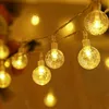 A string of warm white LED lights with crystal bubble bulbs. Náhled obrázku produktu