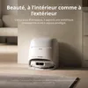 A white robot vacuum cleaner docked in its charging station, placed on a light-colored floor next to a wall. Anteprima dell’immagine prodotto