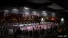 A night-time street soccer game in an urban setting. Produktbild-Vorschau