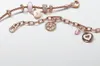 Two rose gold charm bracelets with various charms are displayed on a white background. Produktbild-Vorschau