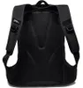 The back of a black backpack is shown against a white background. Voir les images du produit
