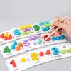 A Montessori learning set for children, featuring wooden numbers and colorful beads for counting and sorting, with a hand using chopsticks to pick up a bead. Produktbild-Vorschau