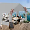 People dining under a tent by a lake. Voir les images du produit