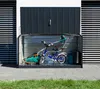 A metal storage box for garden tools and bicycles is shown open, with a lawnmower and a bicycle inside. Náhľad obrázku produktu