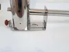 A close-up view of a stainless steel smoking generator with a wooden handle, placed on a white surface. Anteprima dell’immagine prodotto
