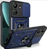 A blue and black phone case with a ring holder is displayed diagonally against a white background. Produktbild-Vorschau