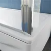 A close-up view of a bathtub with a shower screen. Produktbild-Vorschau
