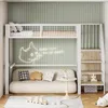 A loft bed with a sofa underneath, set in a bedroom with green striped walls. Anteprima dell’immagine prodotto