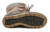 The sole of a brown winter boot is shown against a white background. Anteprima dell’immagine prodotto