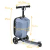 A blue three-wheeled scooter with a built-in suitcase, showing various dimensions with measurement lines and text. Produktbild-Vorschau