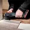A person is using a Metabo multitool to cut flooring near a door frame. Náhľad obrázku produktu