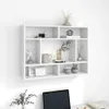 A white wall-mounted shelf unit filled with decorative items. Voir les images du produit
