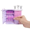 A hand is holding a toy nail set, which is part of a larger toy playset. Podgląd zdjęcia produktu