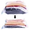 Two vacuum-sealed bags of clothes, one above the other, with an arrow indicating compression. Anteprima dell’immagine prodotto