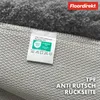Close-up view of the underside of a rug, showing the backing and a care label. Produktbild-Vorschau