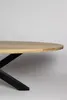 A close-up side view of an oval wooden dining table with a black metal base. Voir les images du produit