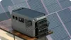 A portable power station is connected to solar panels, suggesting an off-grid or sustainable energy setup. Náhled obrázku produktu