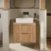 A modern bathroom vanity with a vessel sink and a wall-mounted faucet. Anteprima dell’immagine prodotto