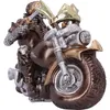 Skeletts, das auf einem Motorrad sitzt.  Trägt eine braune Kutte und eine goldene Kette. Produktbild-Vorschau