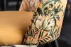 Close-up of a chair with a floral pattern. Produktbild-Vorschau