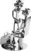 A metal sculpture of a doctor giving a patient a check-up. Anteprima dell’immagine prodotto