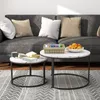 A living room scene with a couch, pillows, and two round coffee tables. Náhľad obrázku produktu