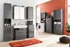A bathroom with modern gray cabinets and a white sink, featuring a washing machine and a plush orange rug. Anteprima dell’immagine prodotto