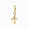 A gold-colored airplane charm hanging from a clasp. Náhled obrázku produktu