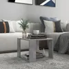 A modern living room scene with a concrete-effect coffee table in the foreground. Podgląd zdjęcia produktu
