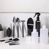 A collection of gardening tools for bonsai and succulents, including shovels, a rake, a blower, tweezers, and watering bottles, arranged on a white surface against a white background. Náhled obrázku produktu