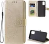 A collage of images showing a gold mandala-embossed flip phone case for a Samsung Galaxy A53 5G, with its interior card slots and phone holder visible. Produktbild-Vorschau