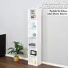 A tall, narrow white bookshelf with several decorative items on its shelves, placed in a room with a plant and a dark cabinet in the background. Produktbild-Vorschau