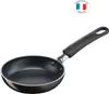 A black frying pan with a black handle, shown from a slightly elevated side angle against a white background. A small circular logo indicating "Fabrique en France" is in the top right corner. Voir les images du produit