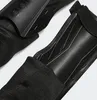 Close-up view of black Adidas shin guards. Produktbild-Vorschau