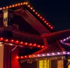 Christmas lights on the roof of a house at night. Náhled obrázku produktu