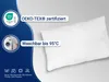 A white pillow is shown on a light gray background with a blue overlay on the left side containing logos and text. Produktbild-Vorschau
