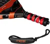 A close-up view of the handle and part of the head of a padel racket, along with a wrist strap. Podgląd zdjęcia produktu