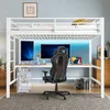 A white metal loft bed with a desk and gaming chair underneath, set up in a room with a blue wall and LED lighting. Produktbild-Vorschau