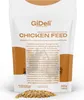 A bag of chicken feed with some feed spilled in front of it. Produktbild-Vorschau