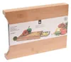 A bamboo cutting board with an integrated stainless steel tray, shown in its packaging. Náhľad obrázku produktu