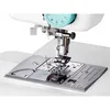 A close-up view of the needle and presser foot area of a white sewing machine. Produktbild-Vorschau